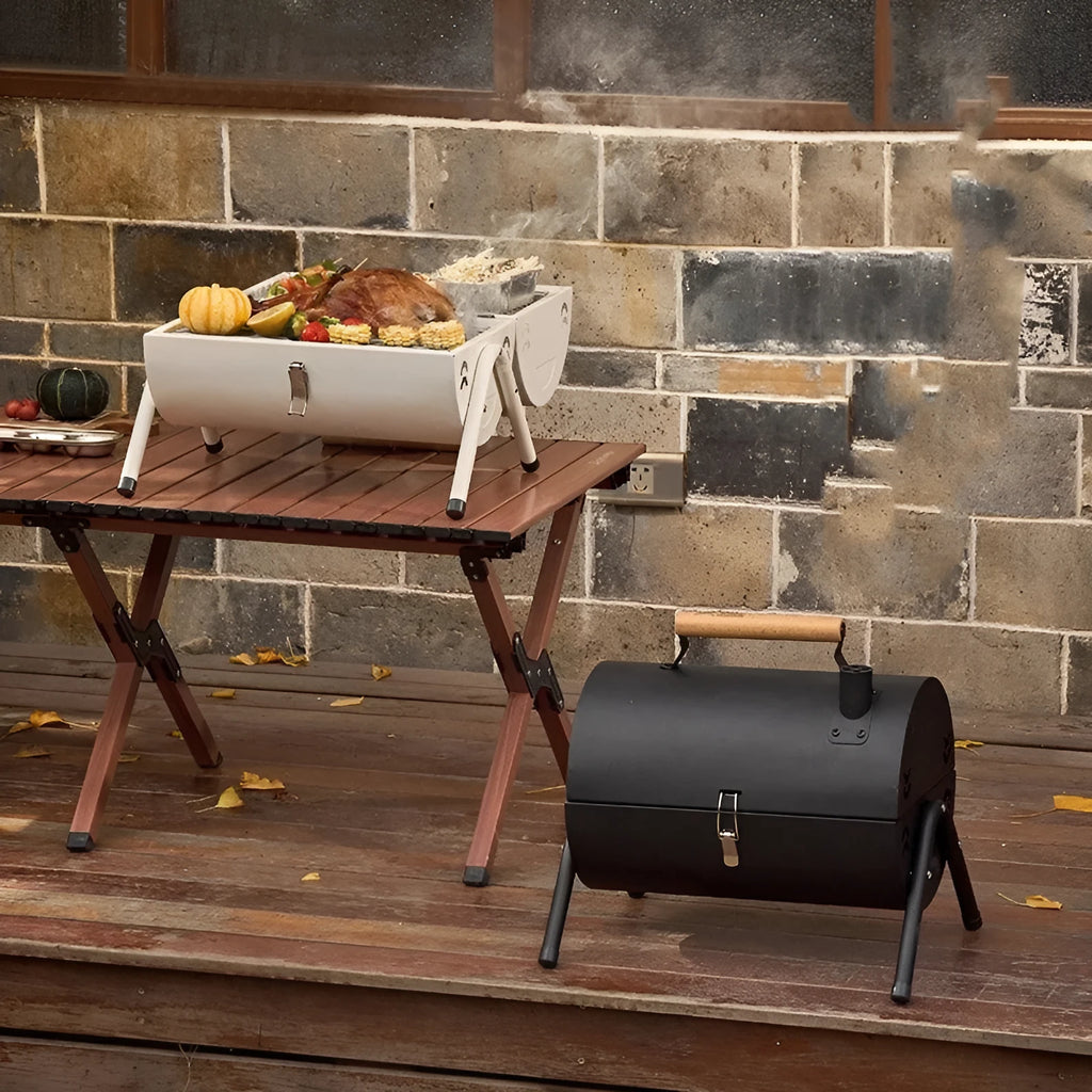 White round portable folding charcoal grill with detachable frying and baking components