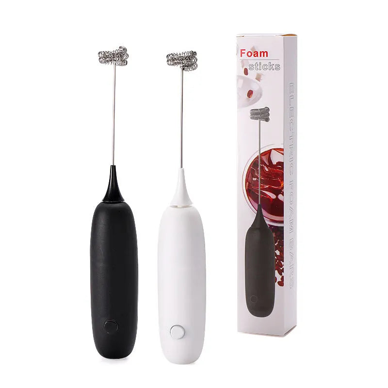 Black and white hand-held electric milk frother blender for coffee