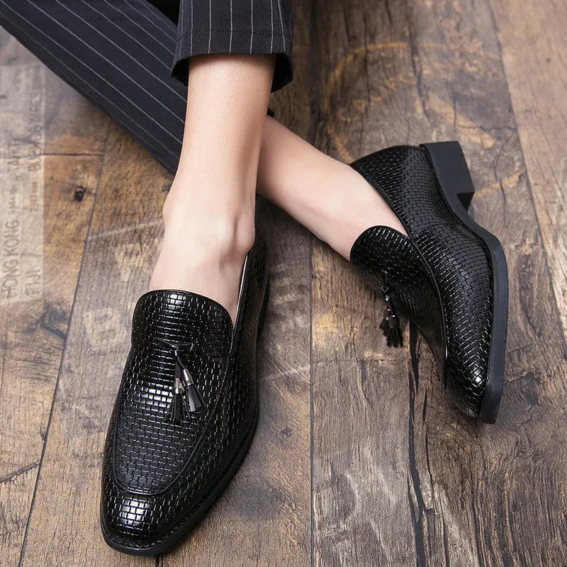 Men's black pointed slip-on business shoes with tassel detail on artificial PU upper