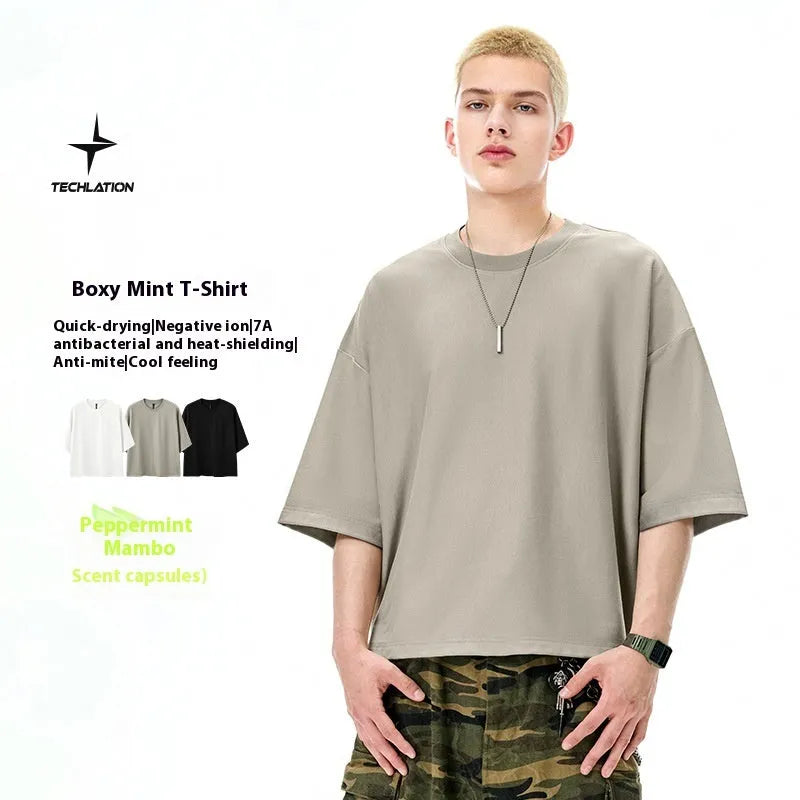 Men's sand grey loose-fit short sleeve t-shirt made from cotton and polyester blend fabric.