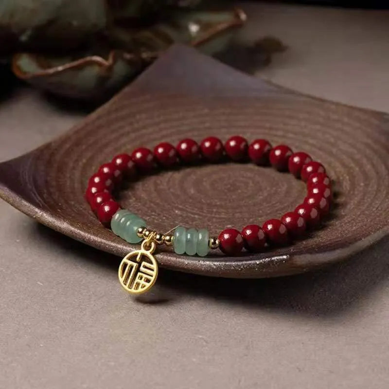 Close-up of a handcrafted wave-shaped cinnabar and copper bead bracelet in national style.
