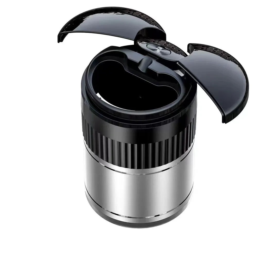 Black automatic sensing touch infrared metal car ashtray with lid on a car console.