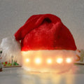 Red and white plush Santa hat with pom-pom and multicolour LED lights lit up around the base.
