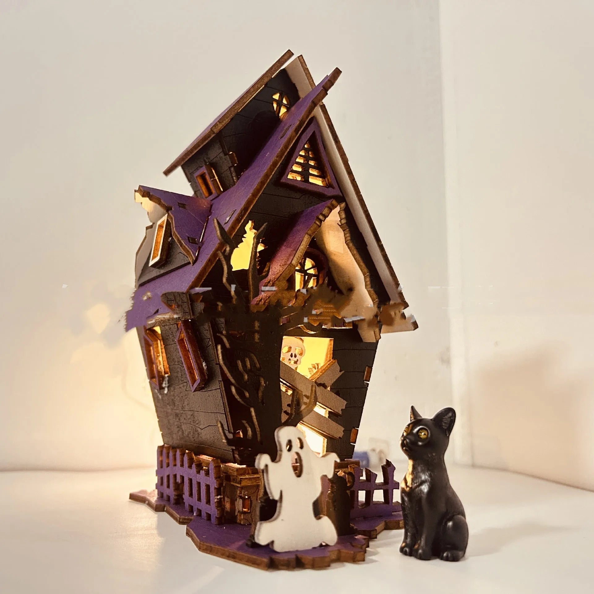 DIY wooden glowing haunted house Halloween decoration with candlestick holder, shown at 14x10.5x19cm size.