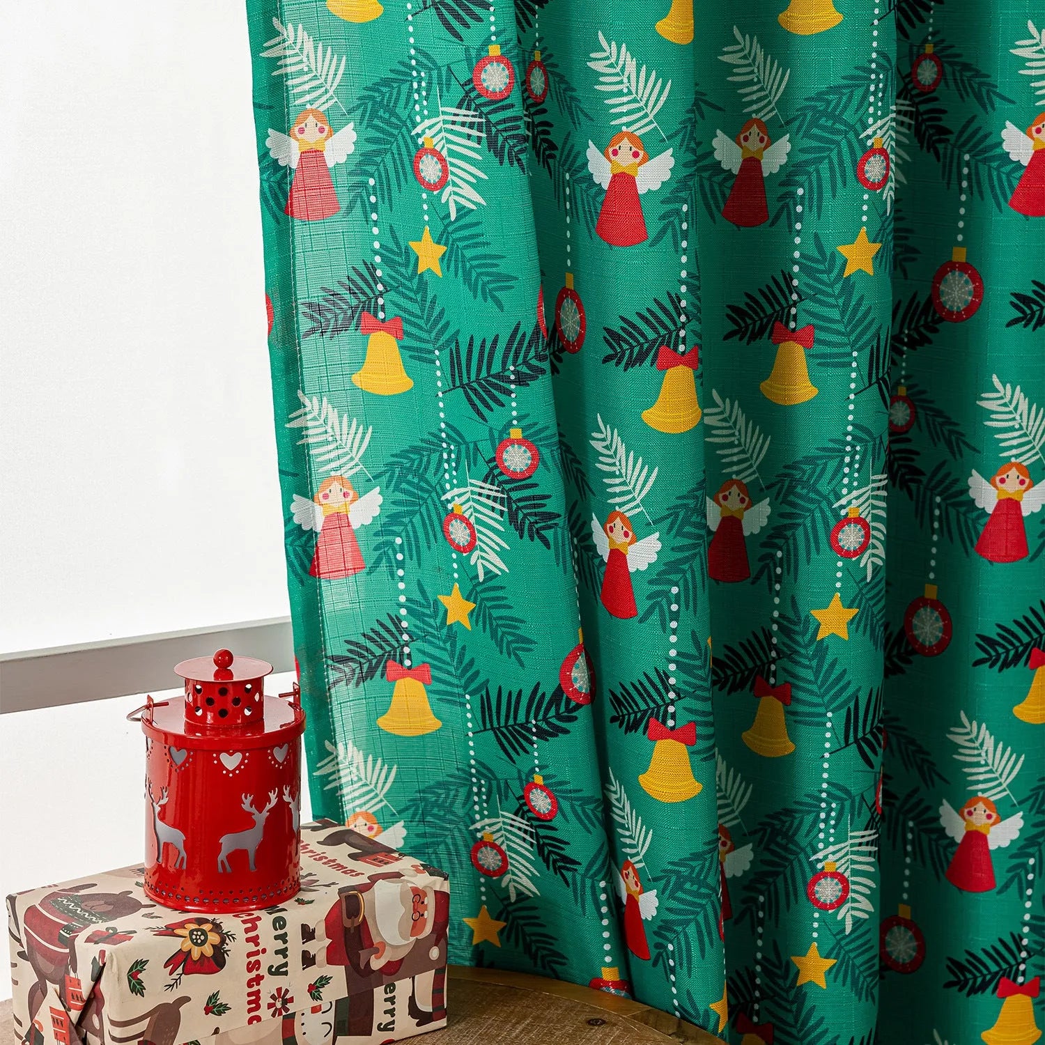 Green Christmas curtain with printed snowman and angel cartoon figures pattern