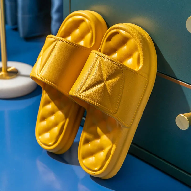 Pair of soft EVA bathroom slippers with a thick non-slip sole, shown in a choice of colours.