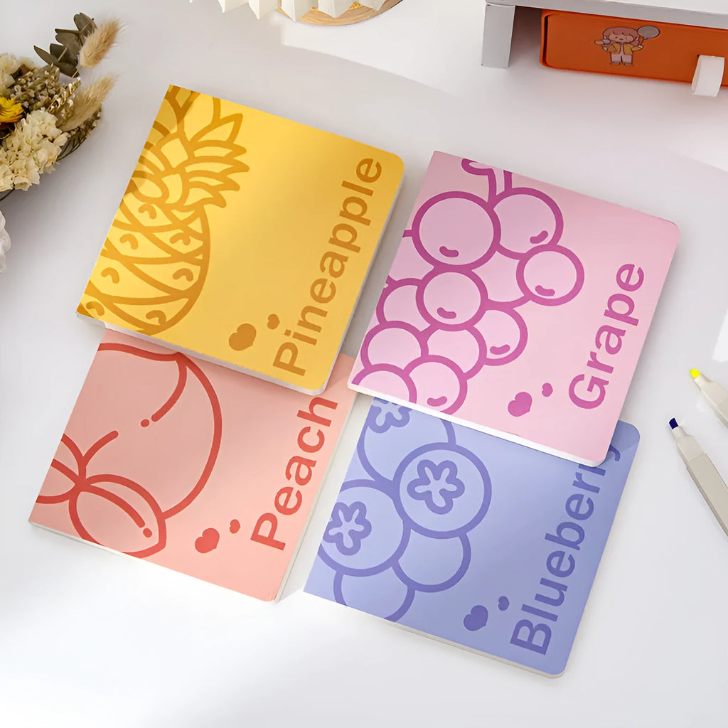 Square fruit design notebook with 14.5cm sides showing colour-embossed cover options.