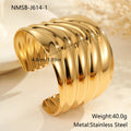 Women's fashion bracelet with exaggerated width, geometric wave patterns, and gold plating