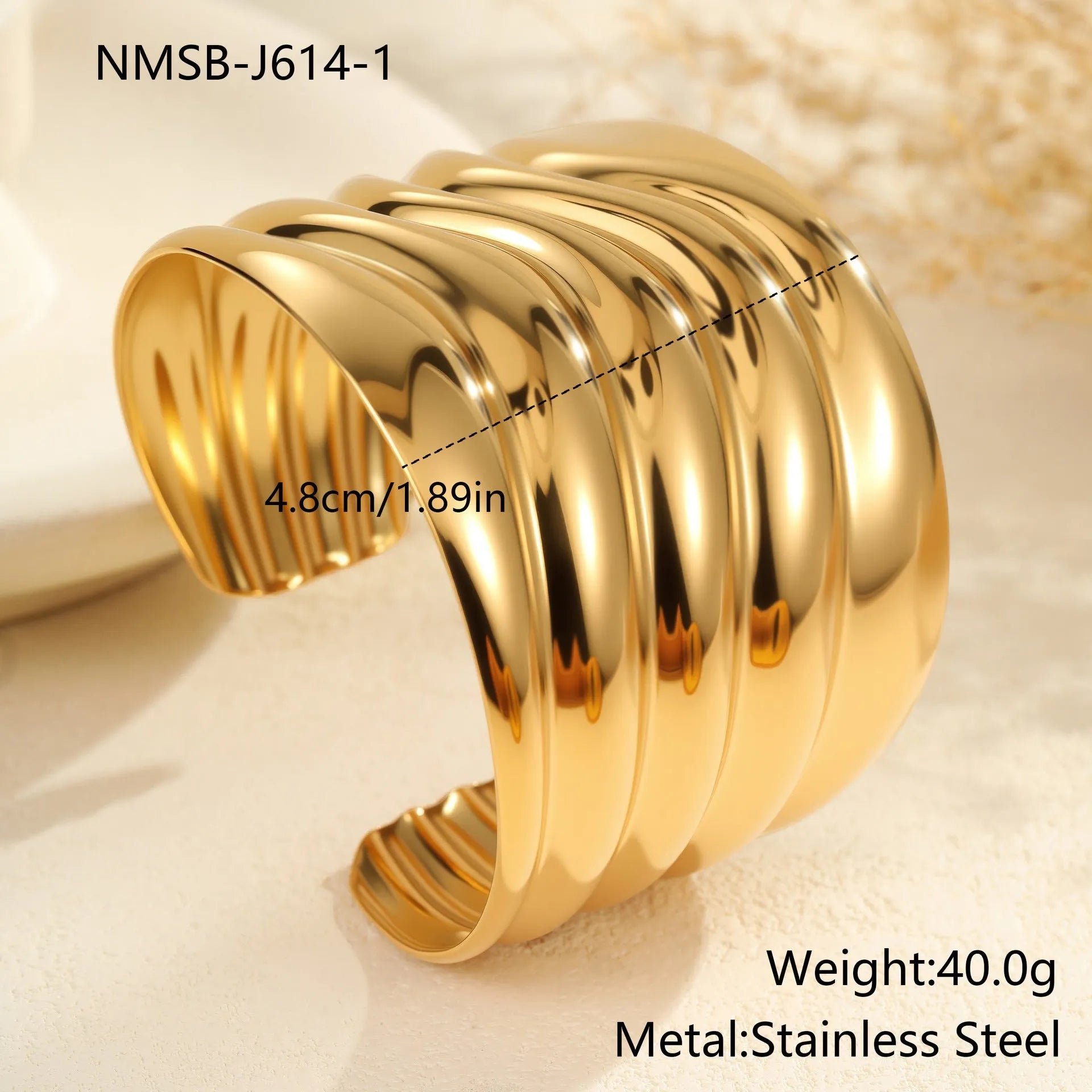 Women's fashion bracelet with exaggerated width, geometric wave patterns, and gold plating