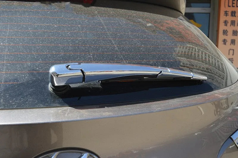Set of four silvery ABS plastic rear window wiper cover trims for a 2010 Hyundai