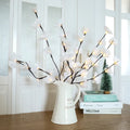 Pink LED phalaenopsis orchid branch decorative light, 65cm long, with warm white illumination on battery power.