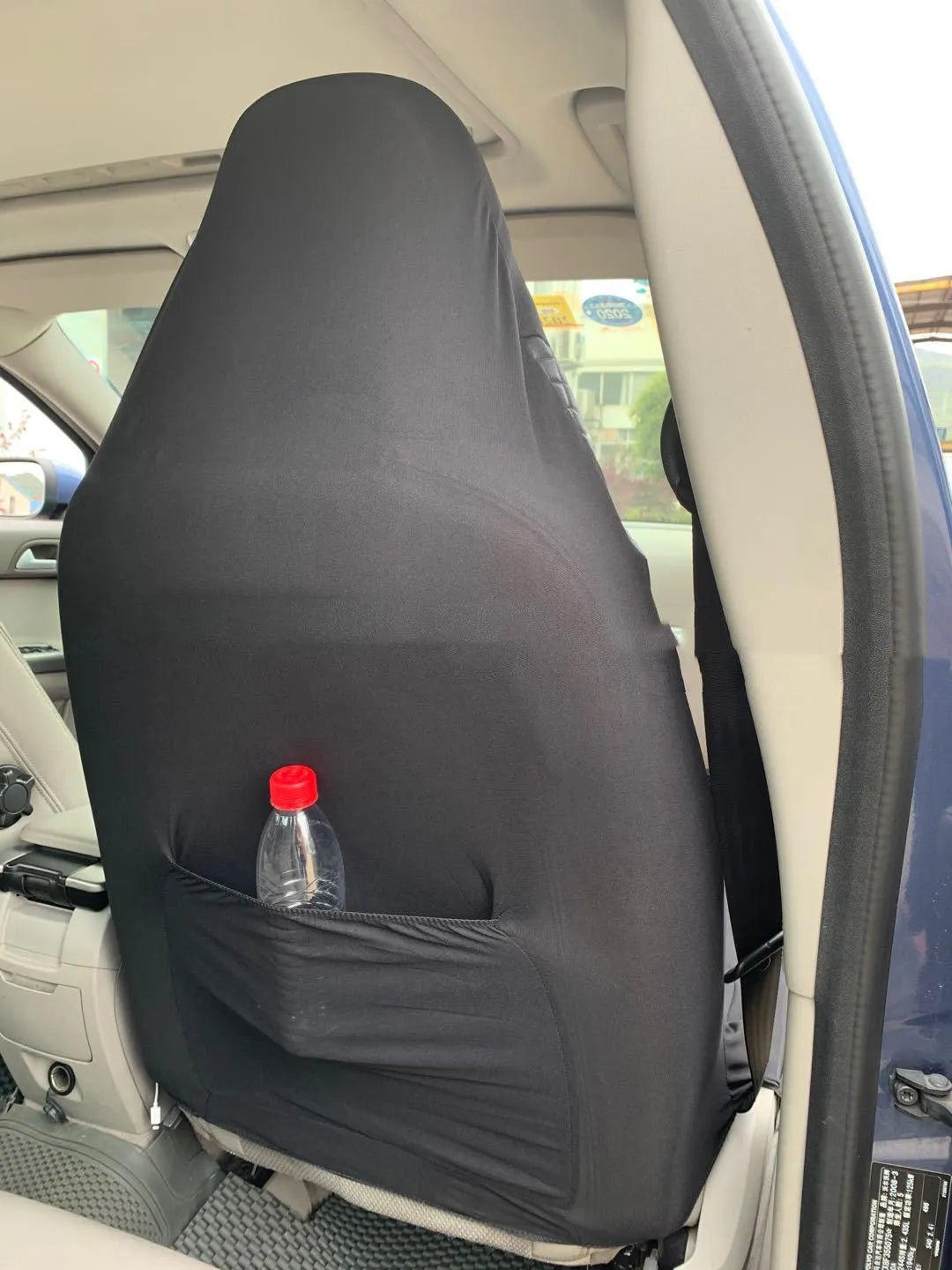 Black quilted automotive seat cover made from PU composite fabric with plastic hooks
