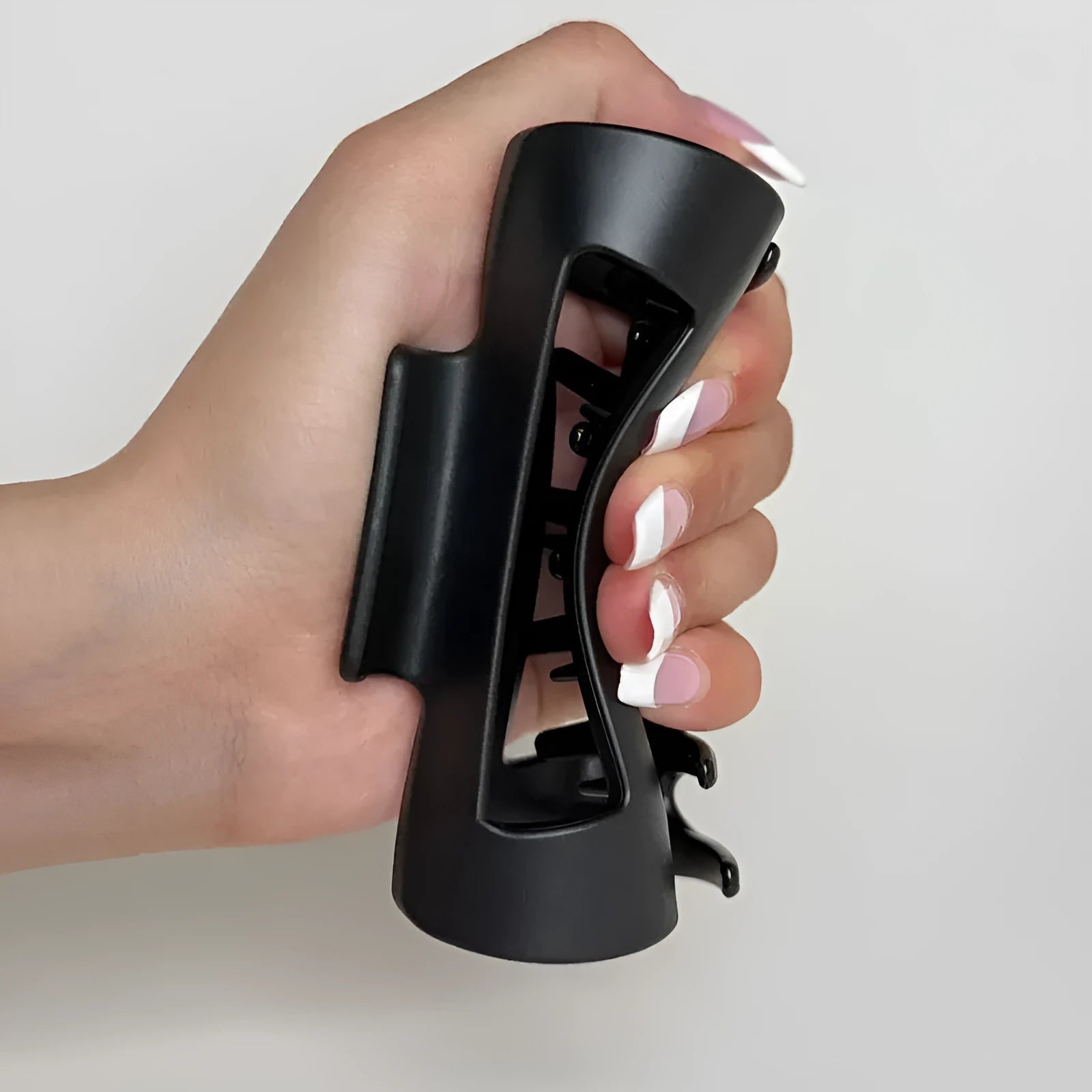 Extra large 13cm soft silicone shark clip in advanced black on a clean white background