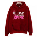Women's pink graphic sweatshirt hoodie with 'I'm A Survivor' slogan and art retro pattern print.