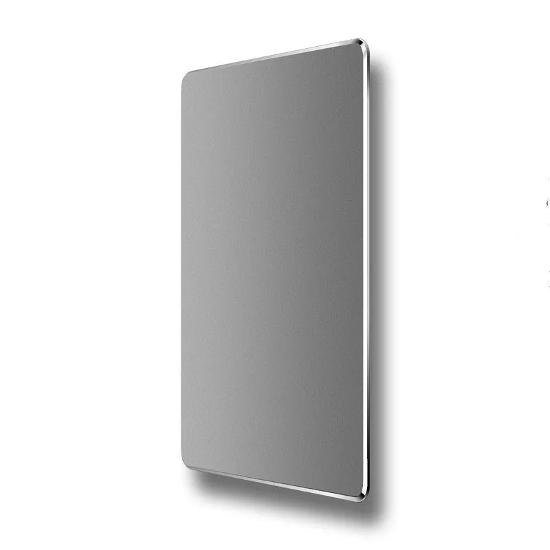 Double-sided aluminium non-slip mouse pad in black on a desk with a mouse and keyboard