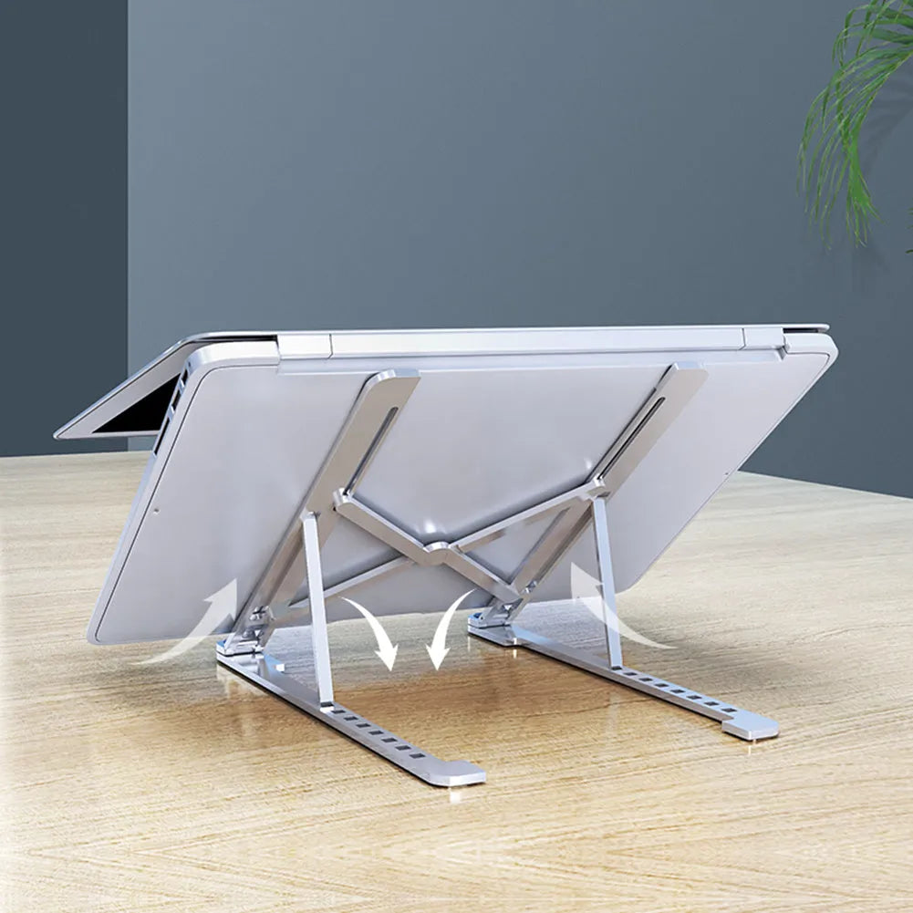 A folded and unfolded aluminium laptop stand in silver, shown next to a laptop.