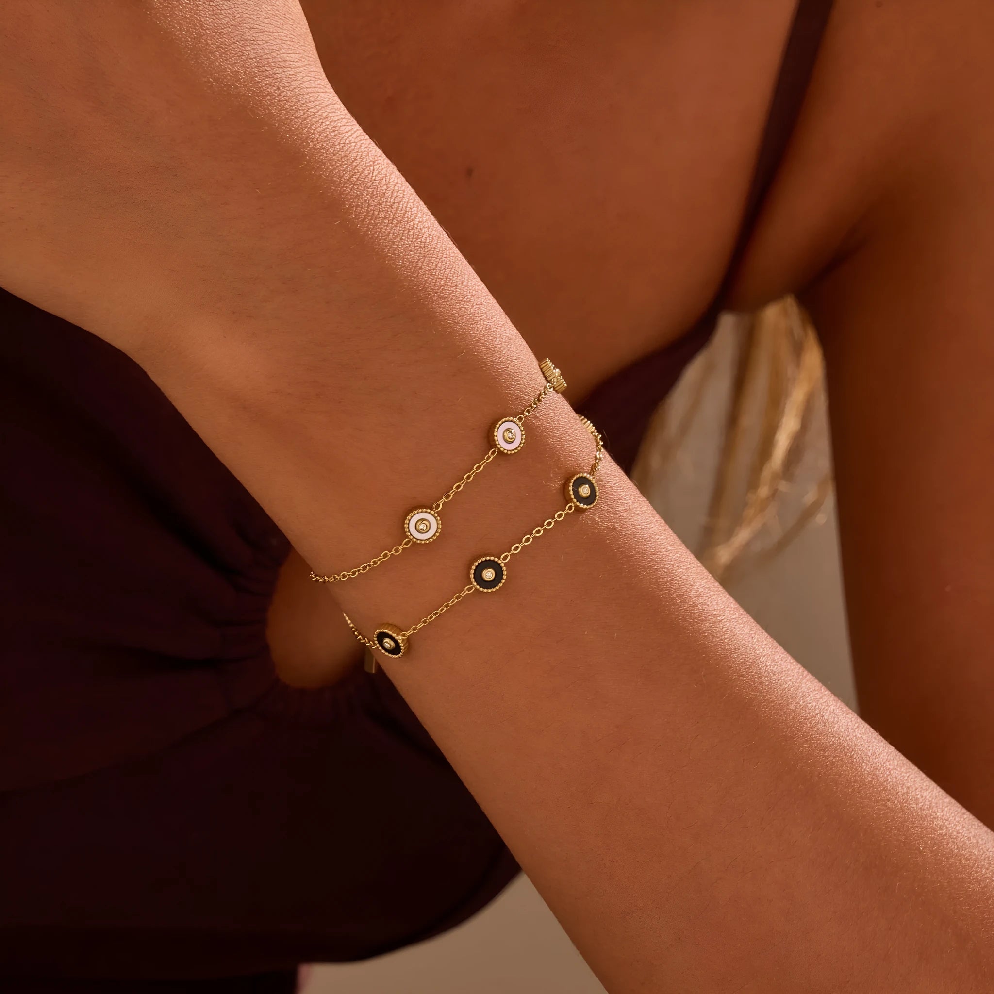 Women's stainless steel bracelet and necklace set with 18K gold plating and geometric design.