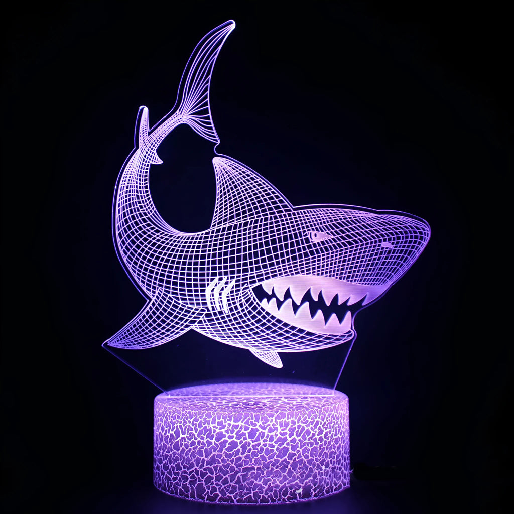 3D acrylic shark table lamp lit with colourful LEDs on a square black ABS base.