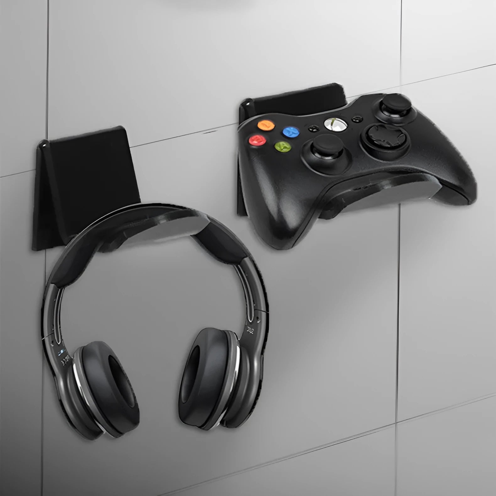 A universal game controller mounting bracket in a choice of black, white, or transparent colours.