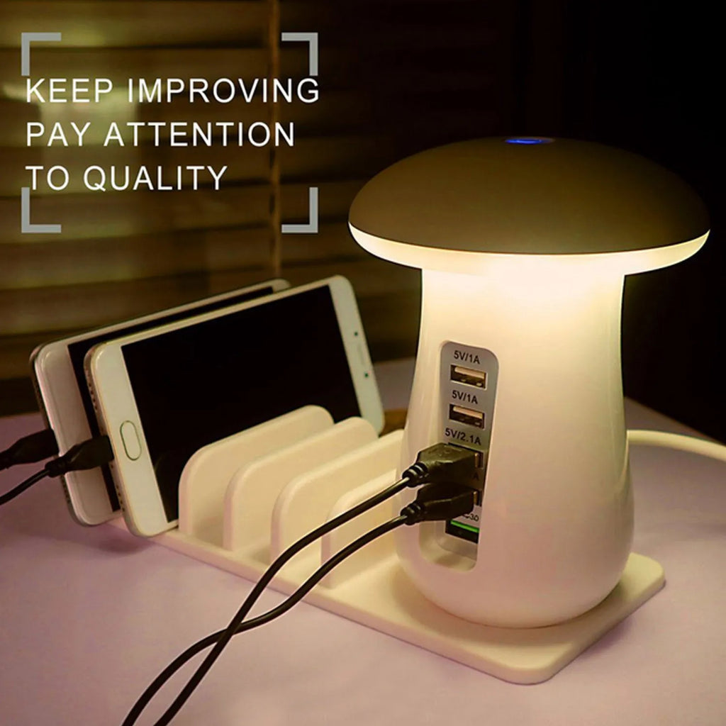 White USB charging dock station with 5 ports and a mushroom-shaped LED night lamp on a desk