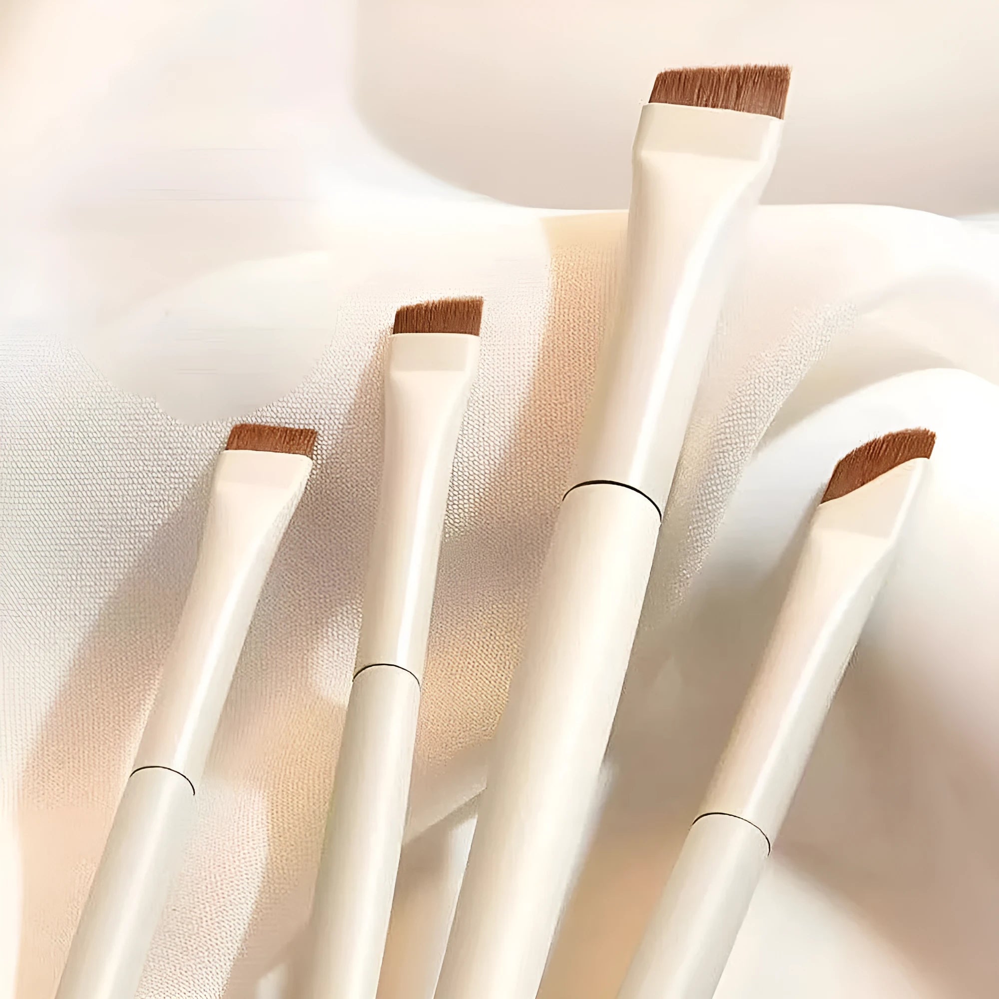 Four angled eyeliner and brow brushes with ultra thin bristles in a leather case