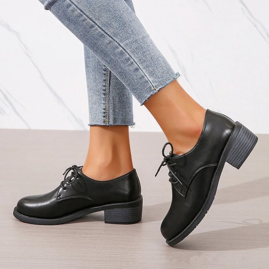 Black women's leather work shoes with thick chunky heel and pointed toe