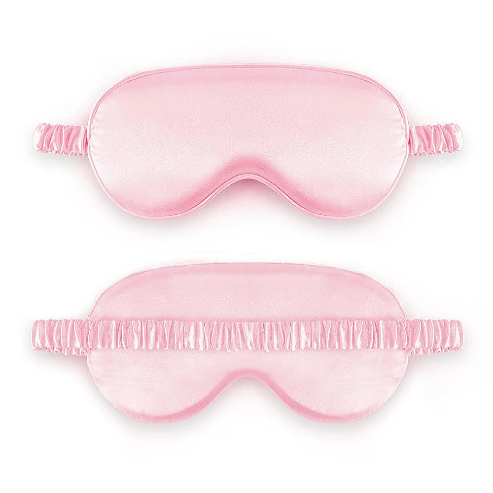 Double-sided silk-like sleep mask in rayon satin, shown in multiple colour options on a white background.