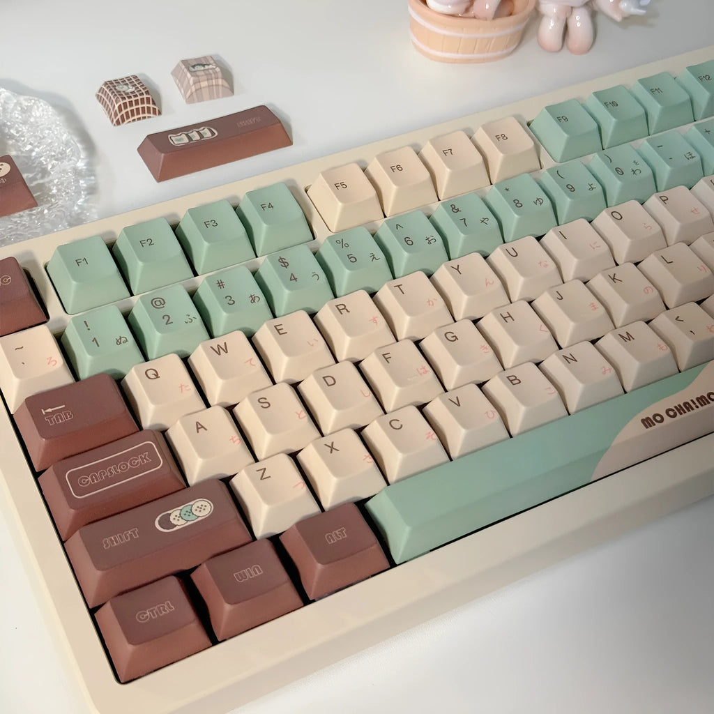 Matcha green themed ergonomic plastic wrist rest for mechanical keyboards with keycap puller.