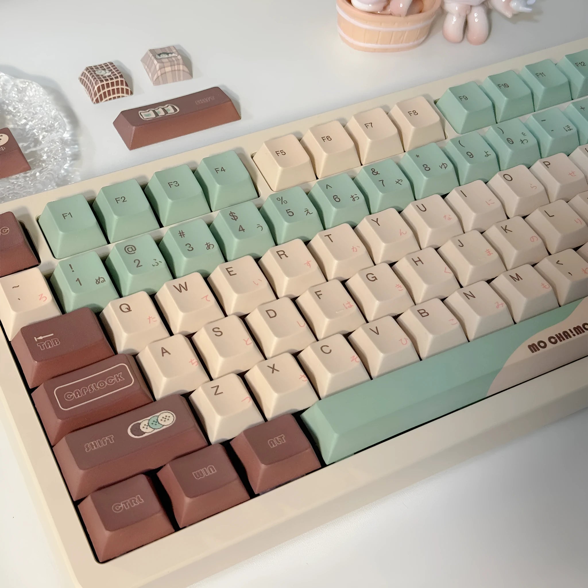 Matcha green themed ergonomic plastic wrist rest for mechanical keyboards with keycap puller.