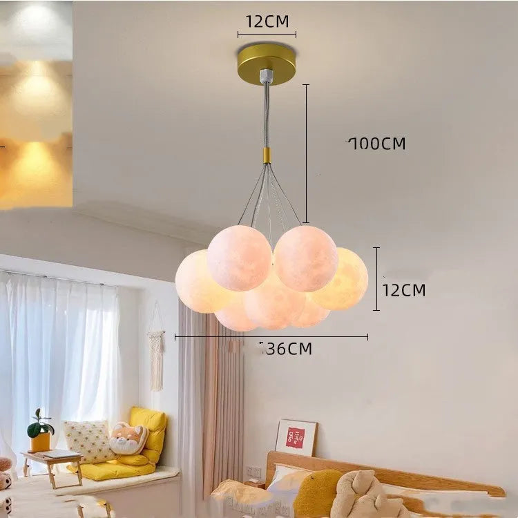 Nordic fish chandelier with moon bubble design in gold or black colours, showing iron body and PMMA lampshades
