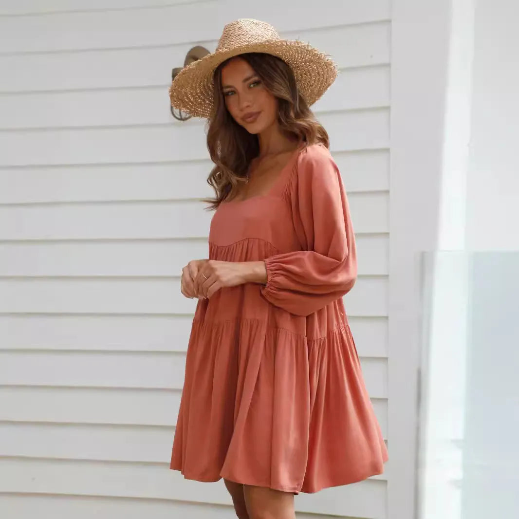Girl in a light blue square collar puff sleeve backless A-line summer dress.