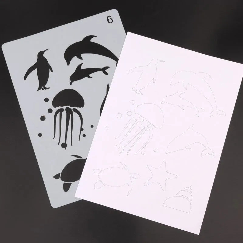 Set of white plastic drawing stencils with assorted cut-out patterns for crafts and decoration.