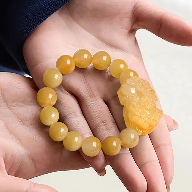 Hand-carved Golden Thread Jade money bracelet with coin design, shown in two bead size options.