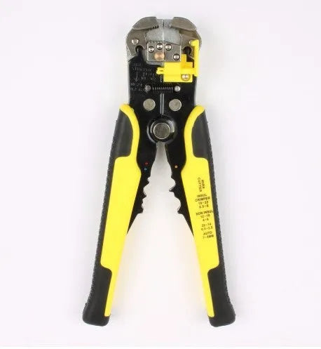 Yellow automatic 3-in-1 wire stripper and crimper tool for electrical cables on a workbench.