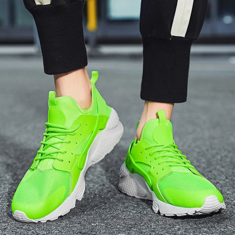 Men's green mesh low-top casual shoes with front laces and cross shoulder straps on a flat MD sole.