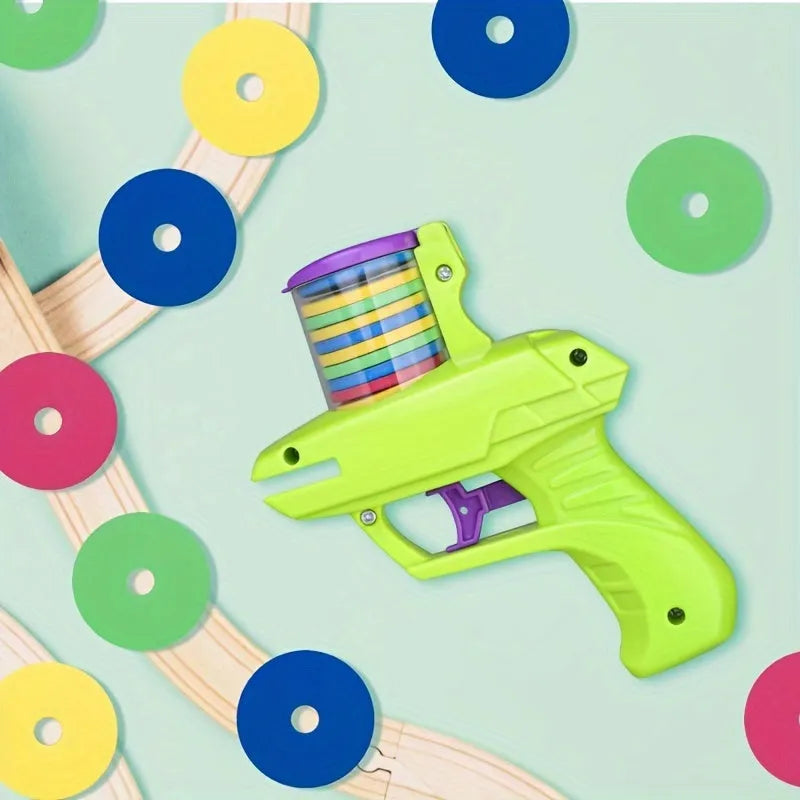 Green interactive cat toy launcher with foam discs for automatic launching play