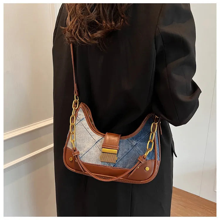 Brown denim women's shoulder bag with chain straps and bucket design showing phone compartment