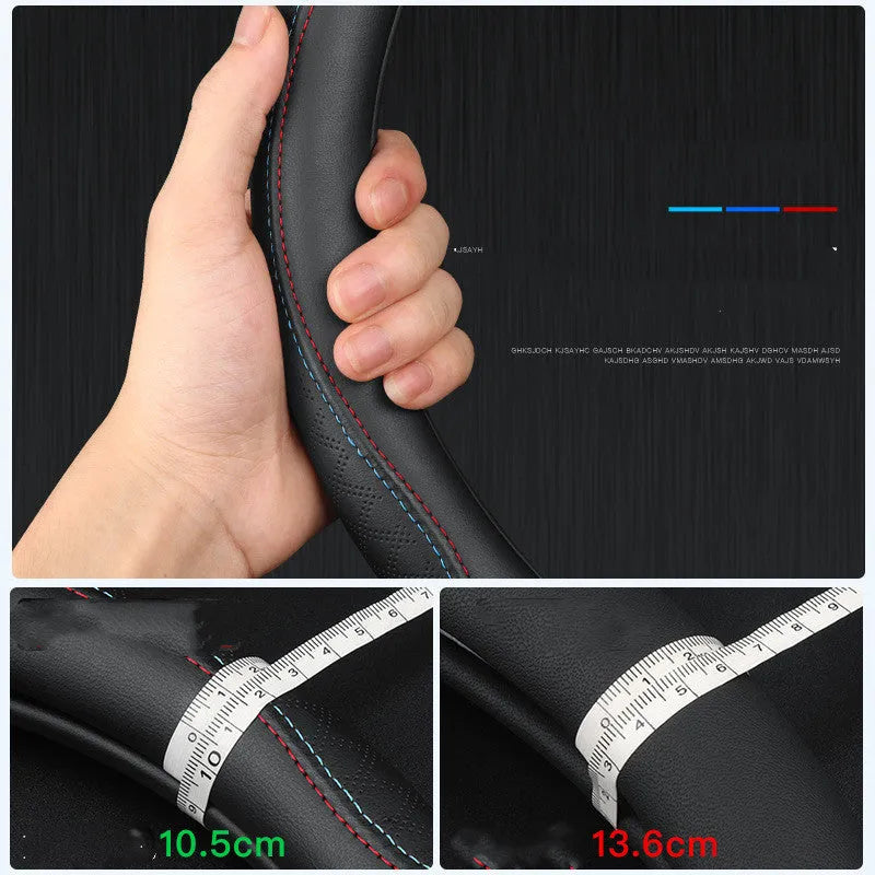 Black leather steering wheel cover with two-colour line detailing showing Napa leather texture and rubber inner ring