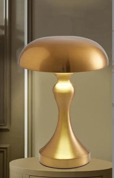 LED desk lamp in bronze finish with USB charging cable and touch controls for three colour temperatures