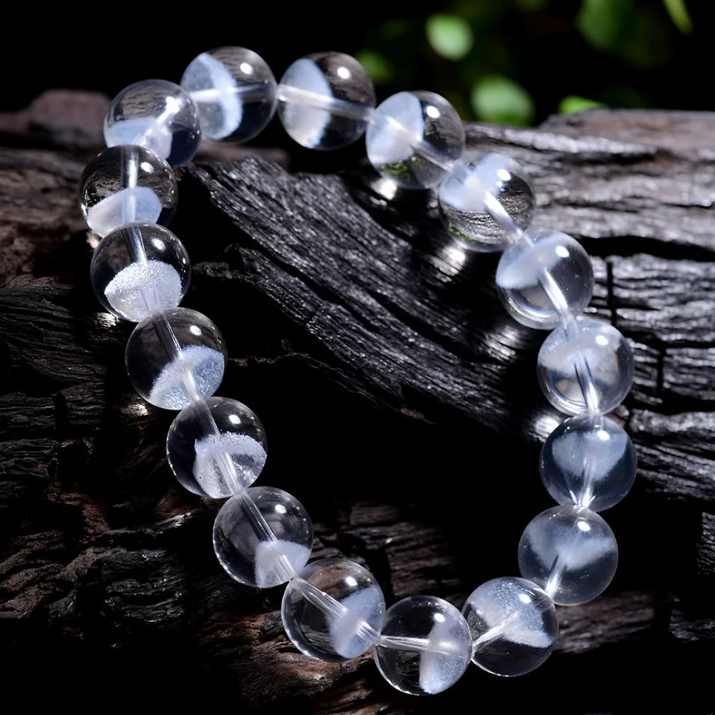 Women's white crystal pyramid bracelet with ghost detail and Ruyi design element