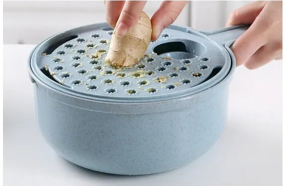 8-in-1 mandoline vegetable slicer with stainless blades, hand guard, and container in blue
