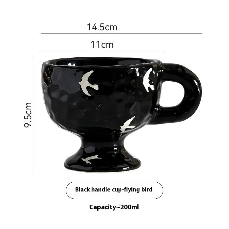 Hand-pinched irregular shaped ceramic mug in a solid colour, modern simple design