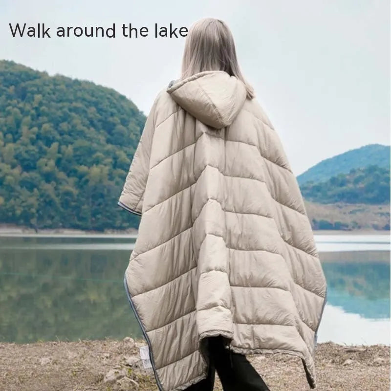 Adult-sized grey outdoor cloak sleeping bag with waterproof nylon exterior shown in wearable cape configuration