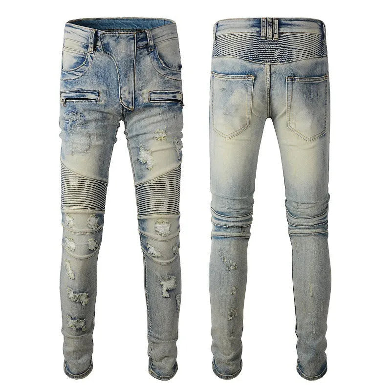 Men's light blue slim fit distressed stretch jeans with hand-frayed detailing on a mid waist with zipper fly.