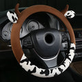 Black short plush steering wheel cover showing protective handle design on 38cm diameter