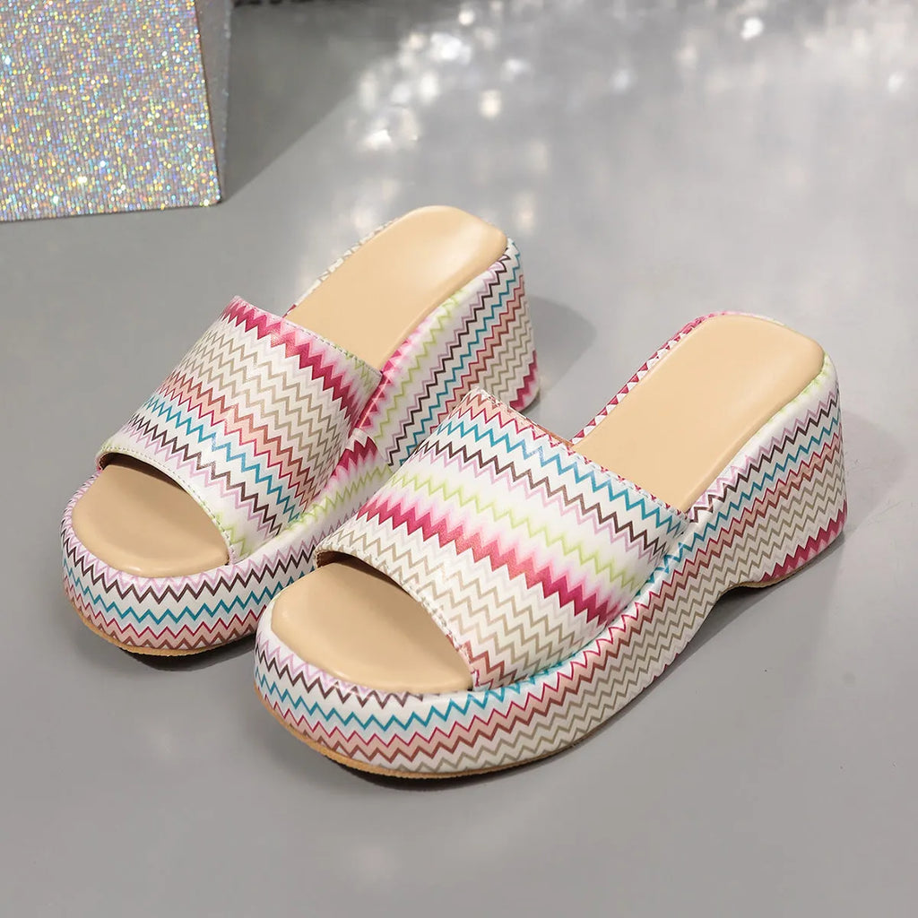 Colourful wave print women's wedge sandals with fish mouth toe and thick rubber sole.