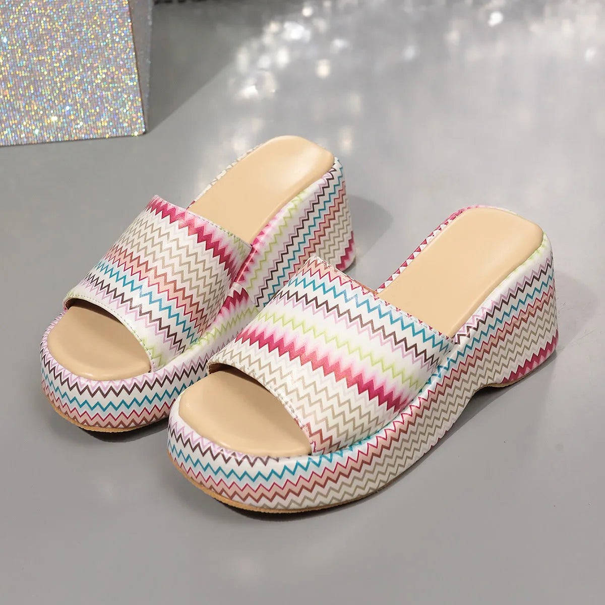 Colourful wave print women's wedge sandals with fish mouth toe and thick rubber sole.