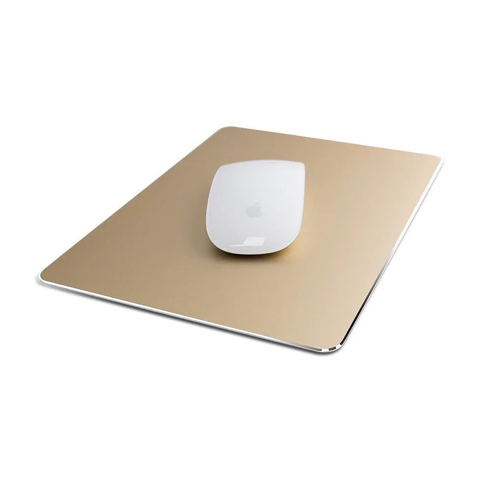 Double-sided aluminium non-slip mouse pad in black on a desk with a mouse and keyboard