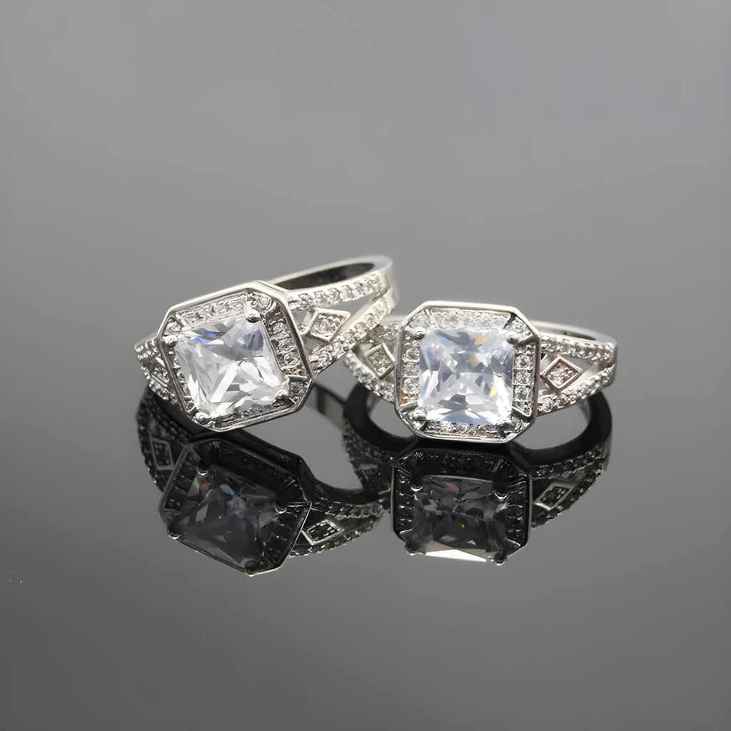 Women's platinum-coloured geometric ring with hollow design and inlaid zircon stones