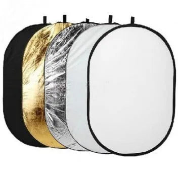 5-in-1 collapsible photography reflector showing gold, silver, white, black, and translucent surfaces folded beside carry bag